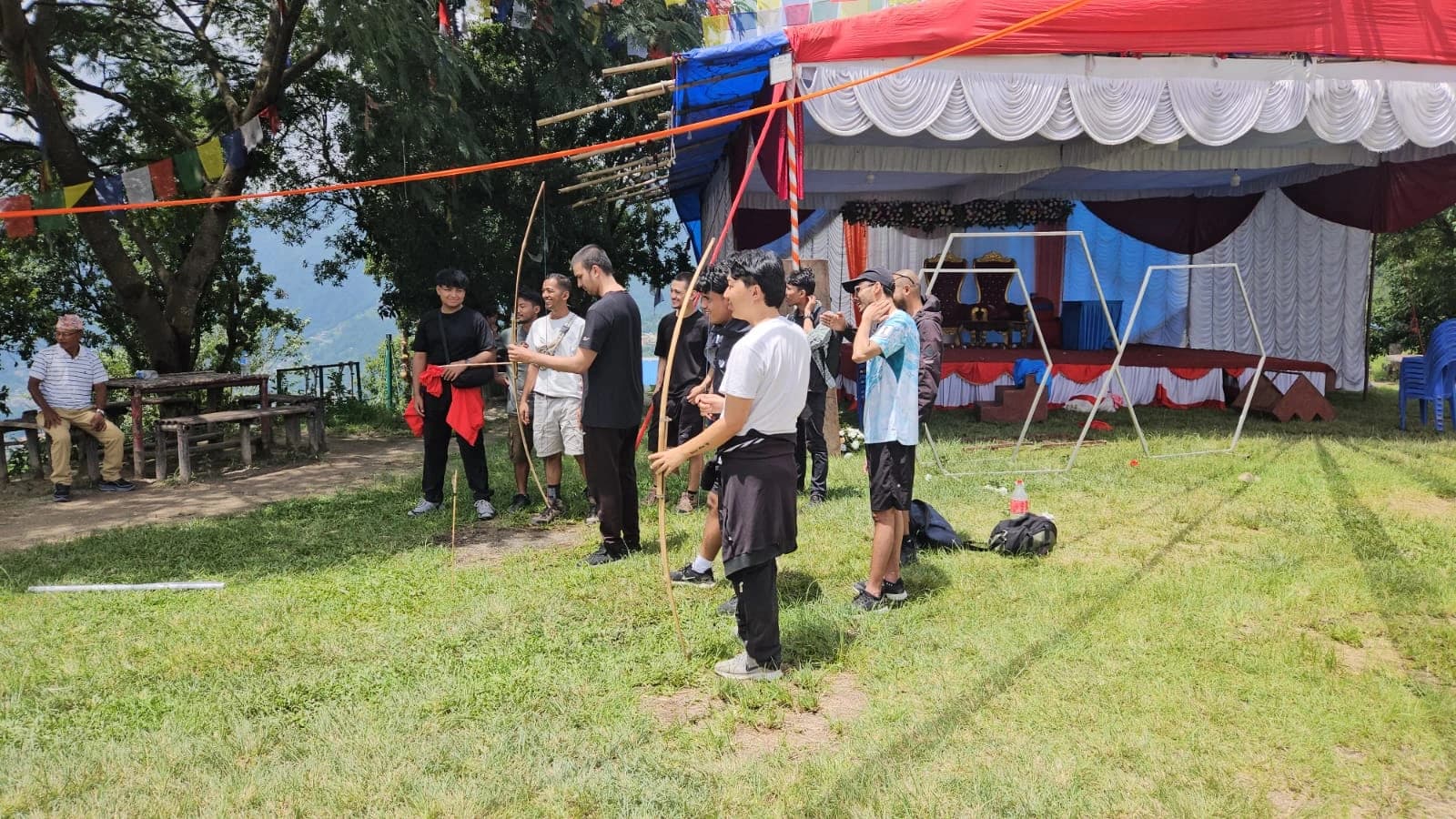 WebX teammates taking part in an outdoor archery activity