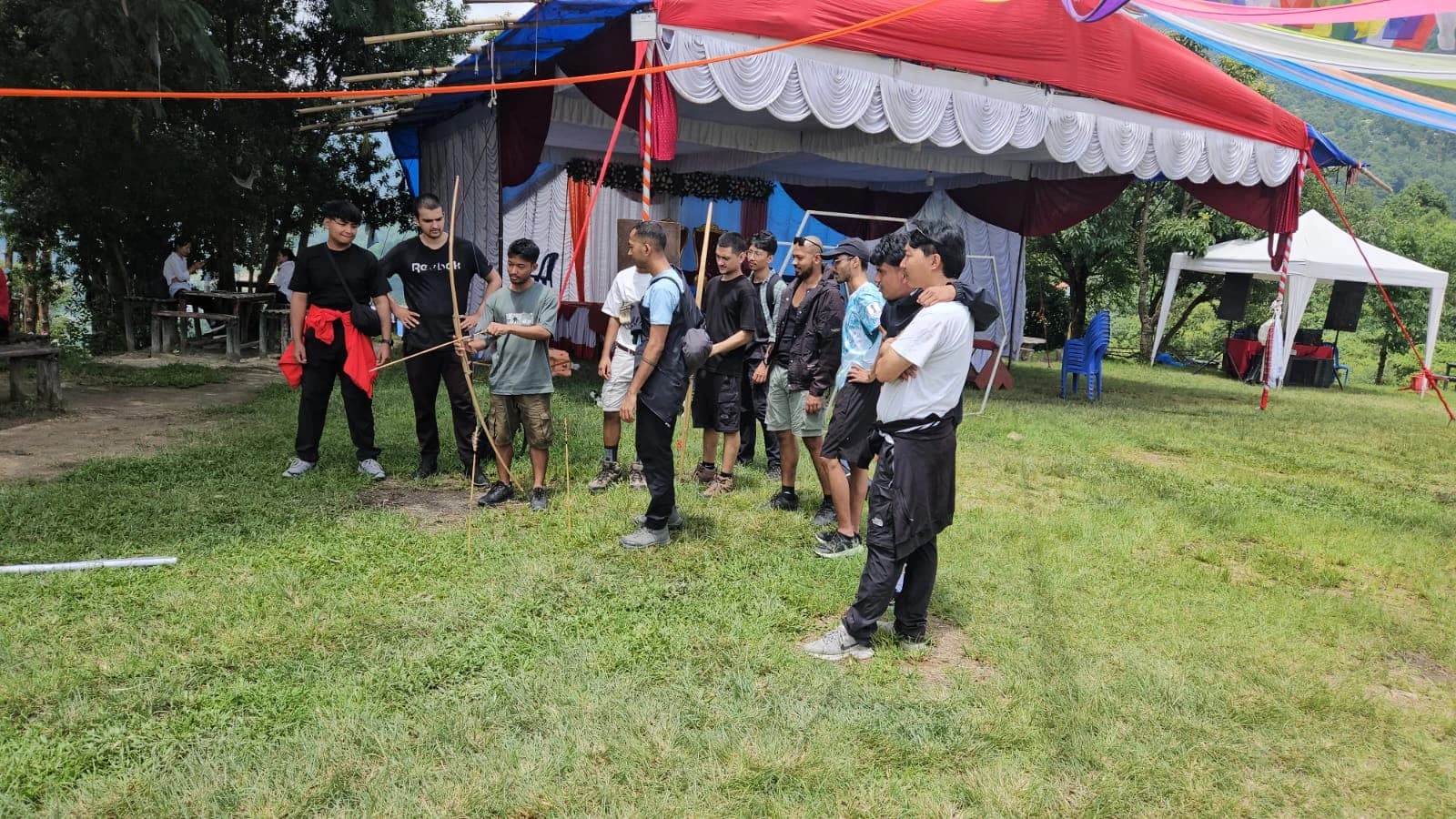WebX team gathered beside an event tent in Tarevir